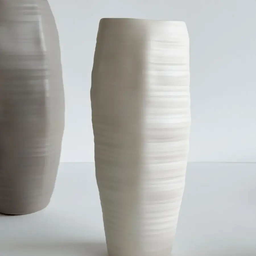 Superior Rina Menardi Rocce vase crafted in baked clay with an organic undulating form and matte beige finish