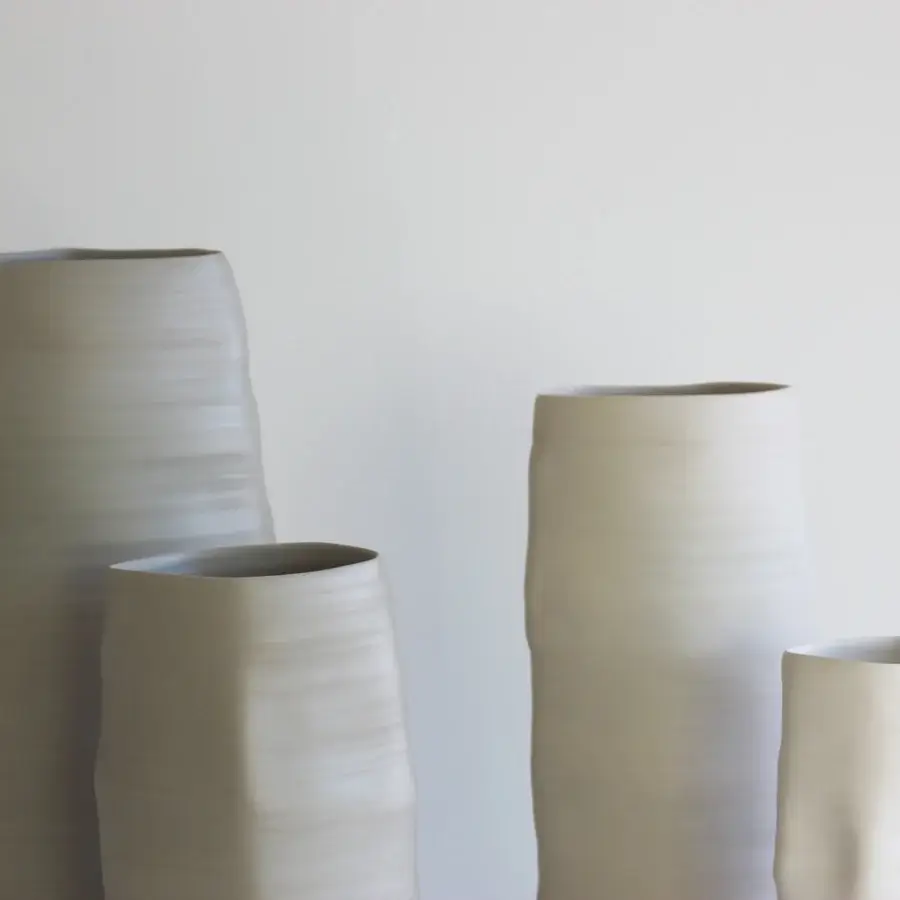 Exclusive Rina Menardi Rocce vase crafted in baked clay with an organic asymmetrical form and neutral beige finish