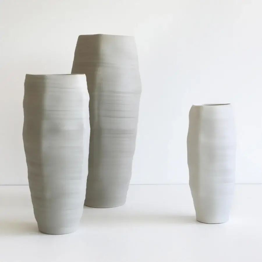 Superior Rina Menardi Rocce vase crafted in baked clay with a matte light gray finish and horizontal striations