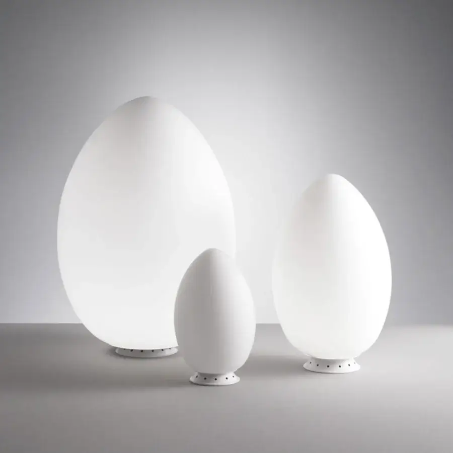 Timeless FontanaArte Uovo table lamp embodying a natural egg-like form in refined white satin blown glass with matte finish