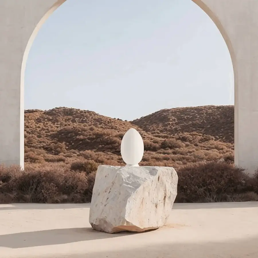 Superior FontanaArte Uovo portable lamp in white satin blown glass with a textured base and smooth surfaces