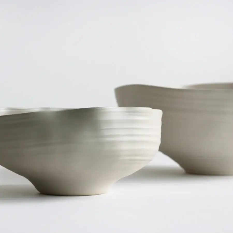 Exceptional Rina Menardi Fonti vessel sculpted from baked clay with a subtly textured, curved form in a pale cream tone
