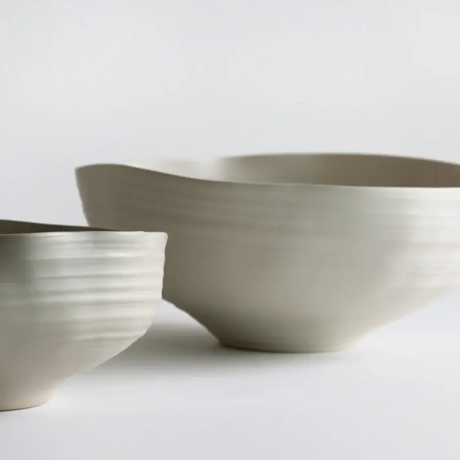 Luxury Rina Menardi Fonti vessel sculpted from baked clay with undulating horizontal lines and a matte finish