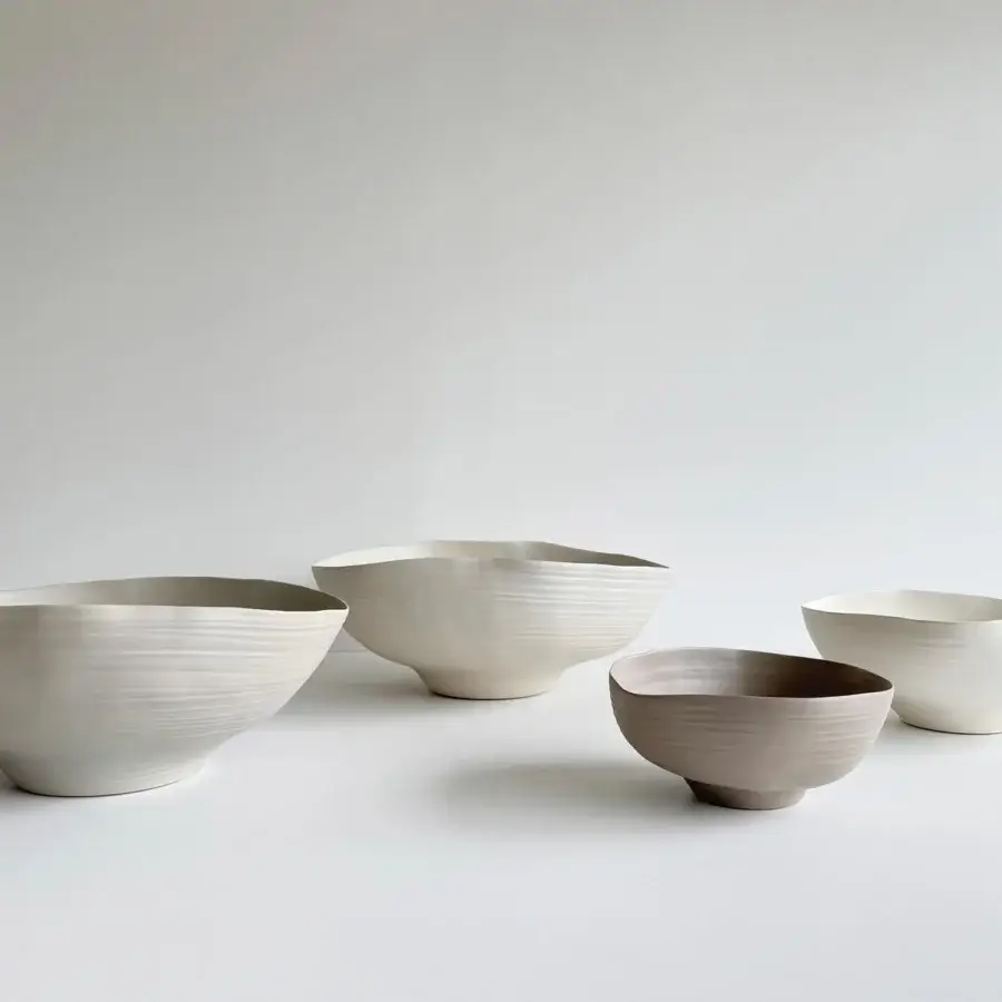 Distinguished Rina Menardi Fonti vessel crafted from baked clay with a subtly textured matte finish and undulating rim