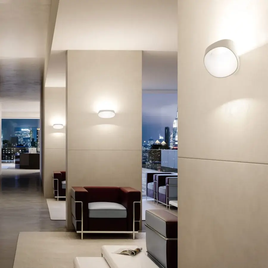 Distinguished FontanaArte Bonnet wall lamp crafted in painted die-cast aluminum with uniform white finish and integrated LED source