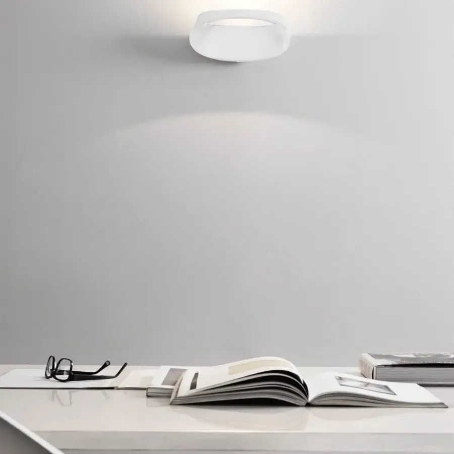 Exceptional FontanaArte Bonnet wall lamp in die-cast aluminum with matte white finish emitting balanced upwards and downwards glow
