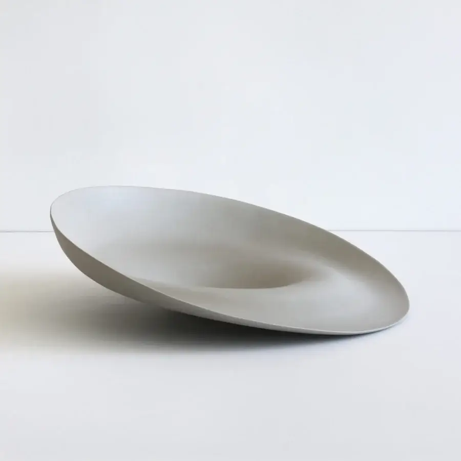 Exclusive Rina Menardi Trottole centerpiece crafted from baked clay in a light gray hue with a smooth matte finish