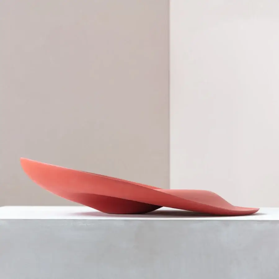 Exceptional Rina Menardi Trottole centerpiece crafted in Italy from baked clay with undulating form and smooth matte finish