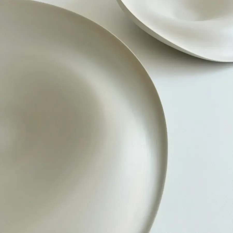 Distinguished Rina Menardi Trottole centerpiece crafted from baked clay in pale beige with a smooth matte finish