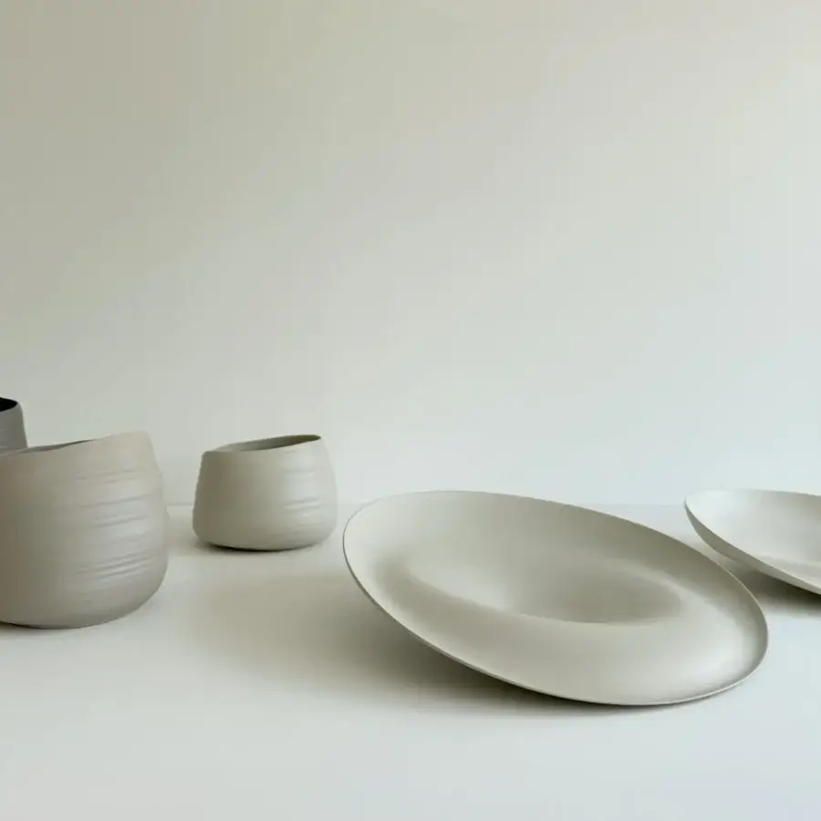 Exceptional Rina Menardi Trottole centerpiece crafted from baked clay with smooth curves and a matte beige finish
