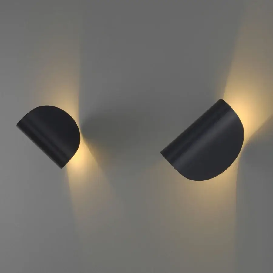 Exceptional FontanaArte IO wall lamp sculpted in a curved form with dark gray painted metal and dual LED emission