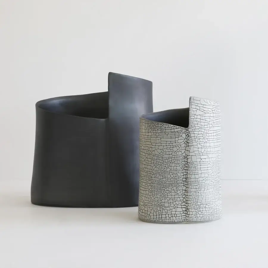Superior Rina Menardi Torri vase sculpted in baked clay with a creamy white base and dark gray cracked glaze finish