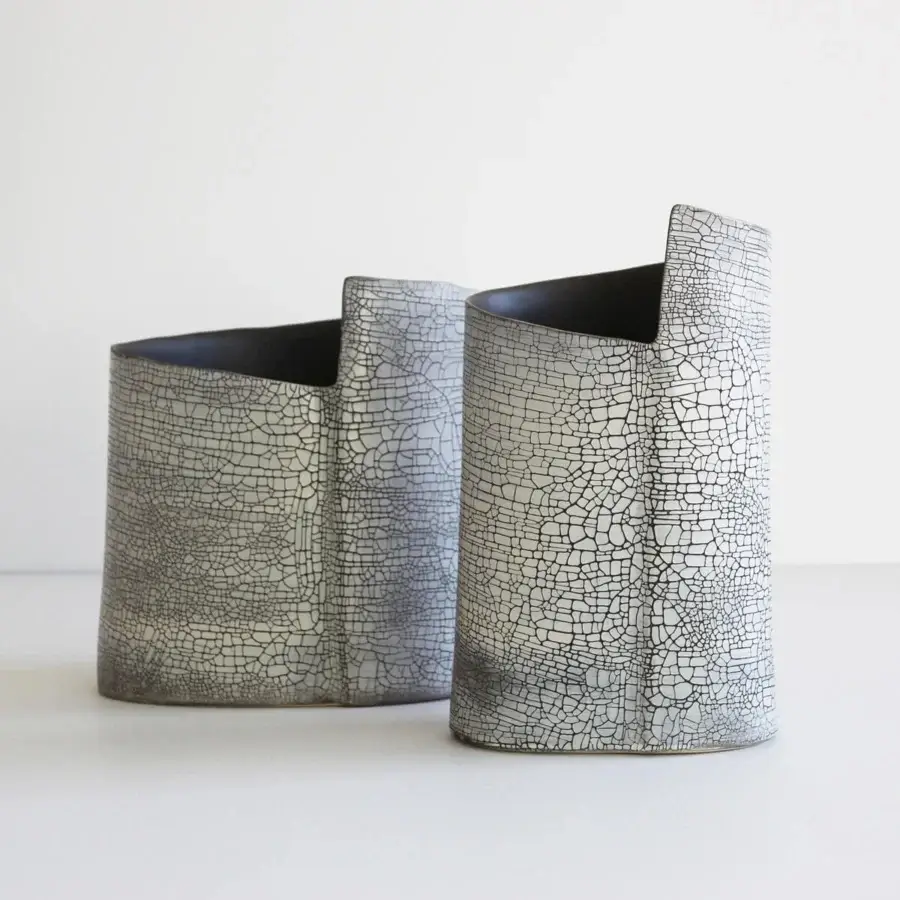 Exclusive Rina Menardi Torri vase crafted from baked clay with a uniquely cracked matte finish and captivating dark lines