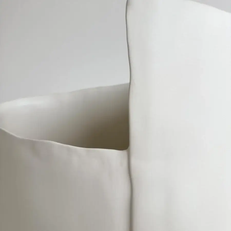 Distinguished Rina Menardi Torri vase sculpted from baked clay in a pale beige hue with a smooth matte finish