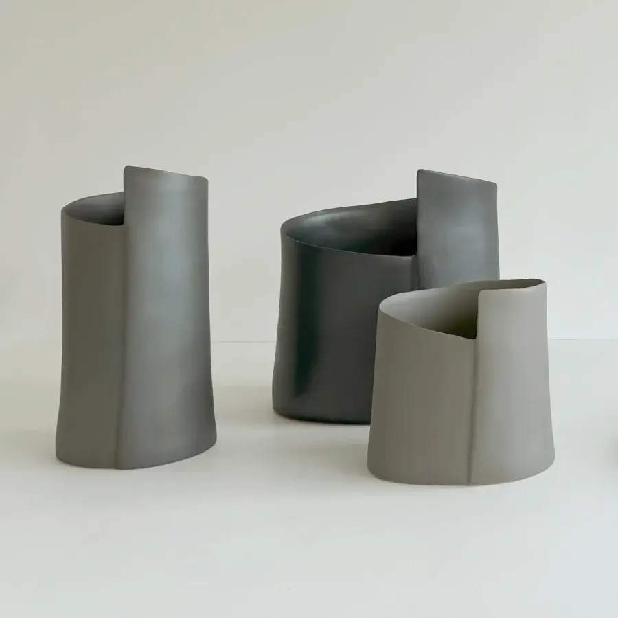 Exceptional Rina Menardi Torri vase crafted in baked clay with a matte finish and subtle tonal variations