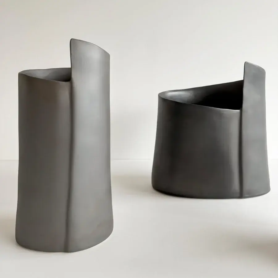 Exclusive Rina Menardi Torri vase crafted in baked clay with a muted gray matte surface and tonal variations