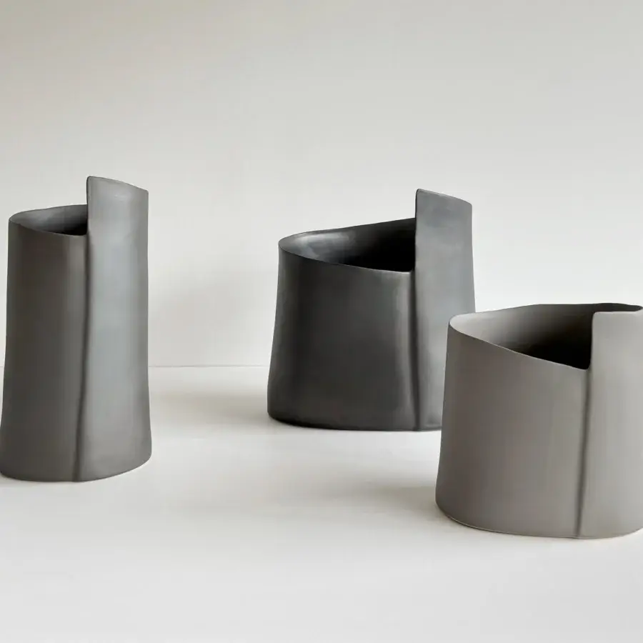 Distinguished Rina Menardi Torri vase set crafted in baked clay with a smooth matte finish and muted gray hues