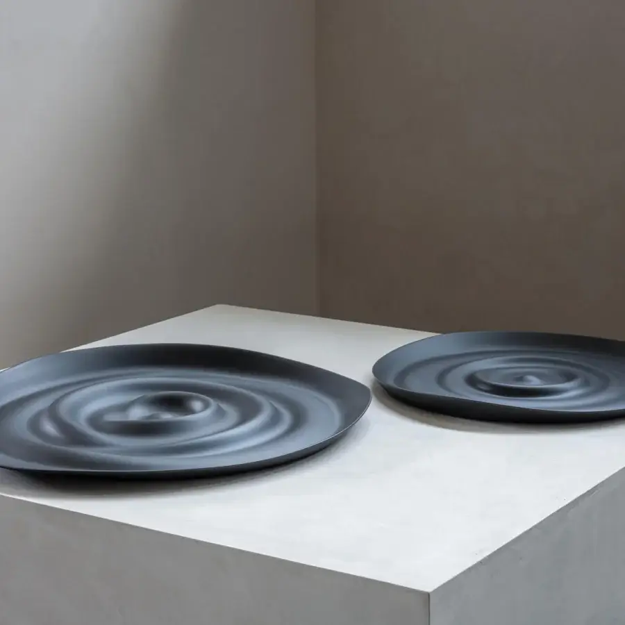 Distinguished Rina Menardi Vortici centerpiece crafted in dark gray baked clay with a unique undulating pattern
