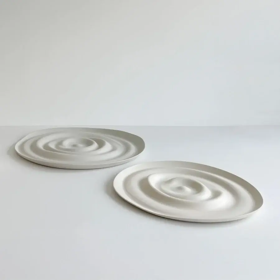 Exclusive Rina Menardi Vortici centerpiece handcrafted in baked clay with a smooth matte off-white finish and organic undulating form