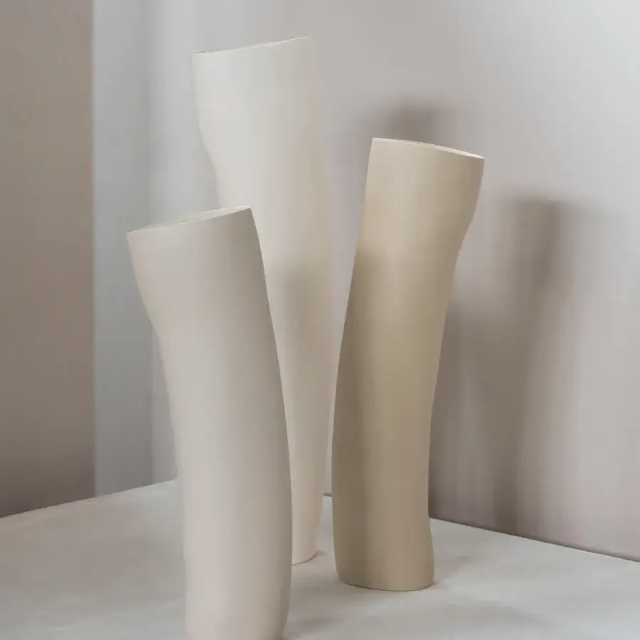 Distinguished Rina Menardi Wind vase sculpted from baked clay in off-white and beige with a matte finish
