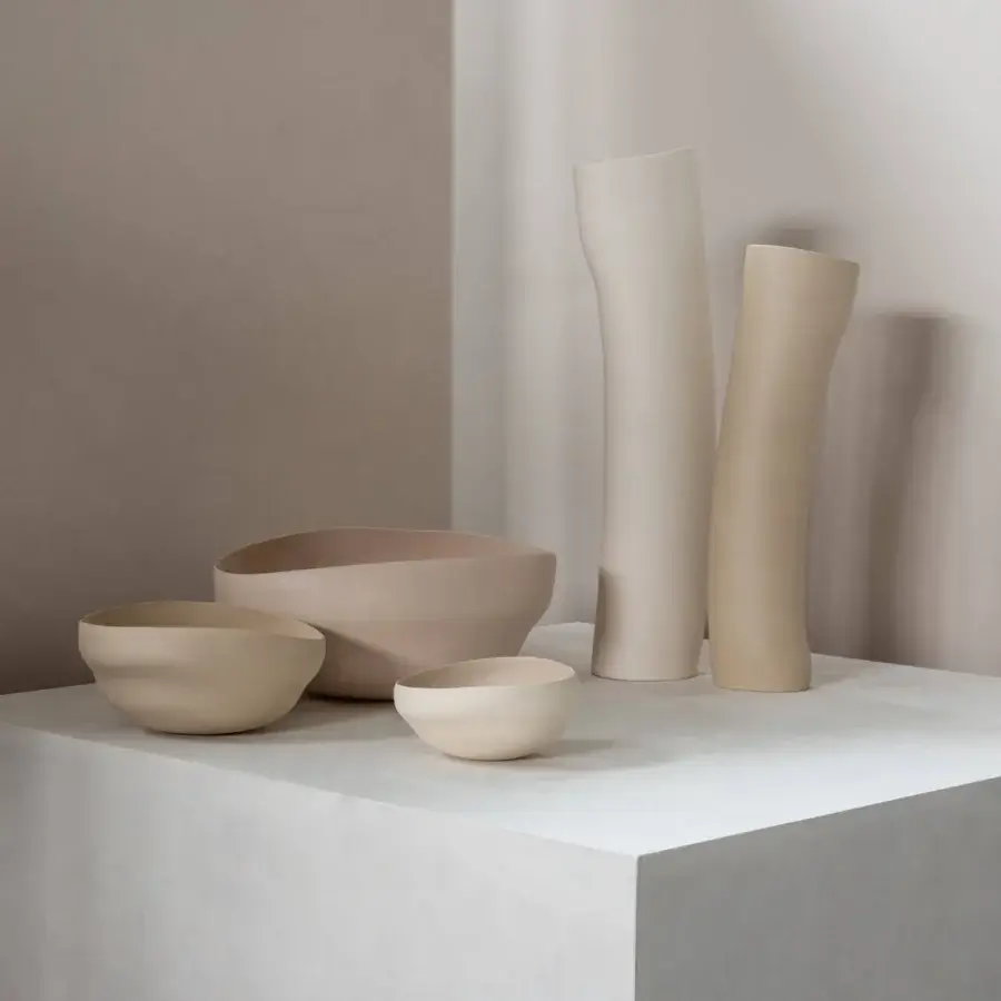 Elegant Rina Menardi Wind vase sculpted from baked clay in pale beige with a matte ceramic finish
