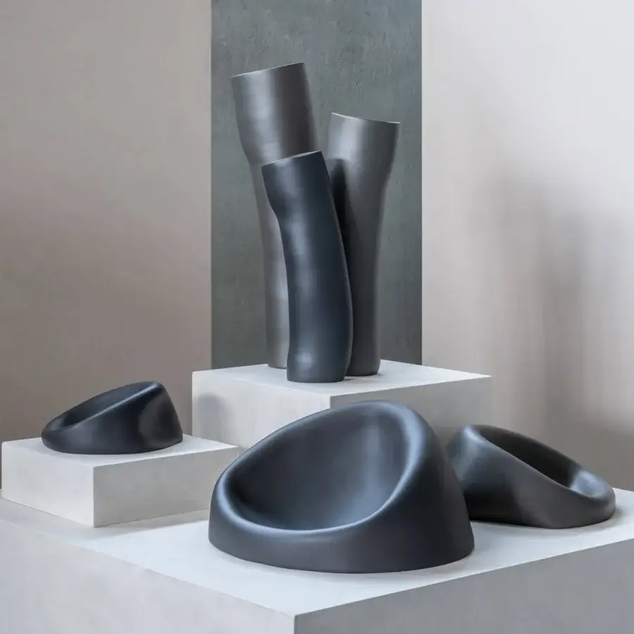 Distinguished Rina Menardi Wind vase sculpted from baked clay in dark gray with a smooth matte finish