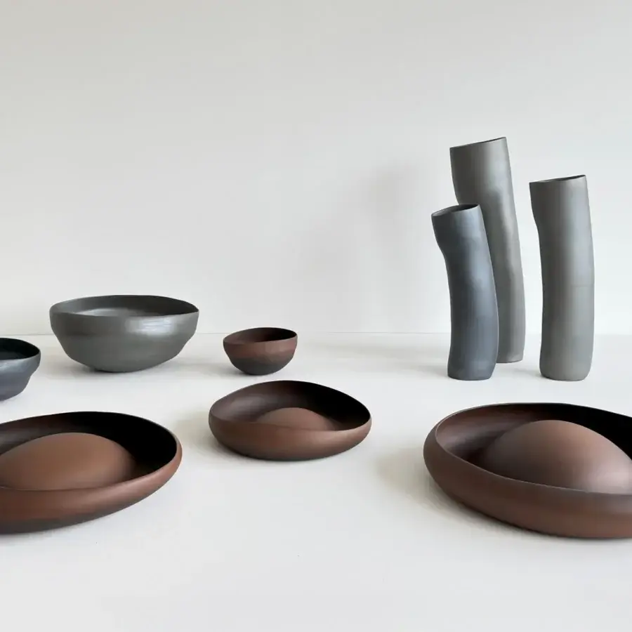 Exceptional Rina Menardi Wind vase sculpted vessel crafted in charcoal gray baked clay with a matte finish