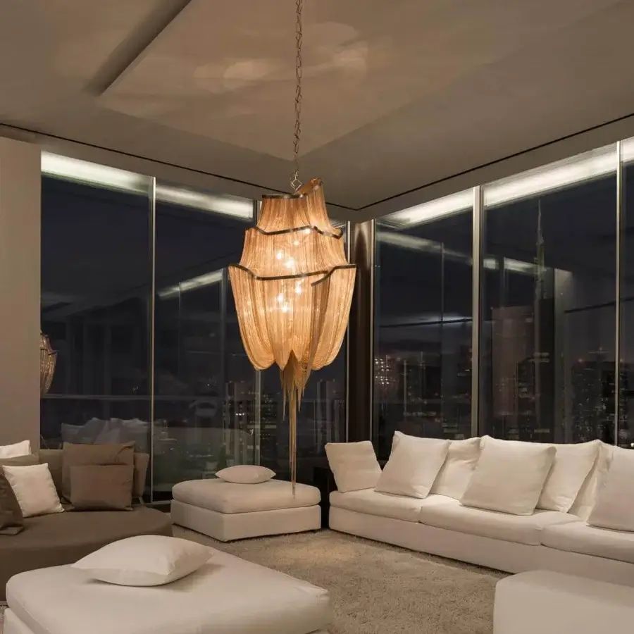 Distinguished Terzani Atlantis suspension lamp crafted in brass chains evoking cascading water with warm golden-brown tones and diffused glow