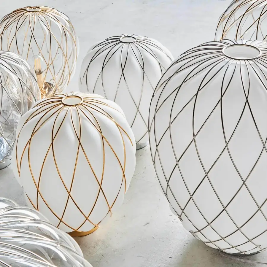 Distinguished FontanaArte Pinecone table lamp crafted with transparent glass and a brilliant metallic cage revealing a two-fold structure
