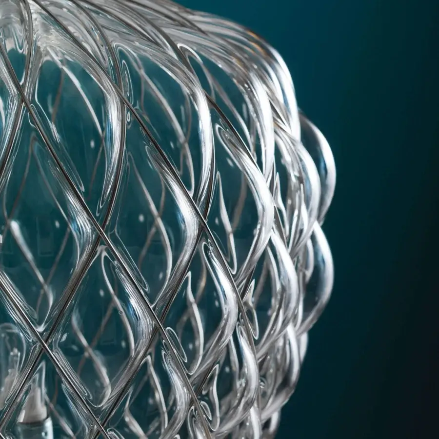 Exceptional FontanaArte Pinecone table lamp crafted with transparent caged blown glass and a glossy galvanic finish