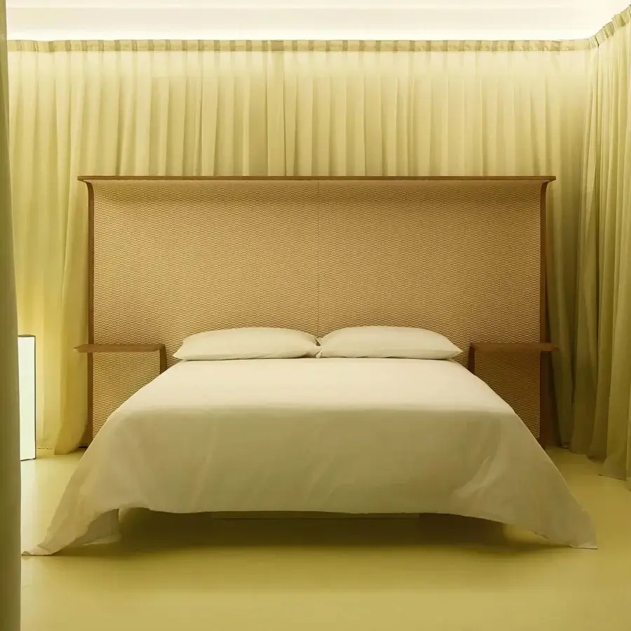 Distinguished Bolzan Letti Courtoisie headboard crafted with laminated wood and curved plywood in a fine oil finish with handwoven Dedar fabric upholstery