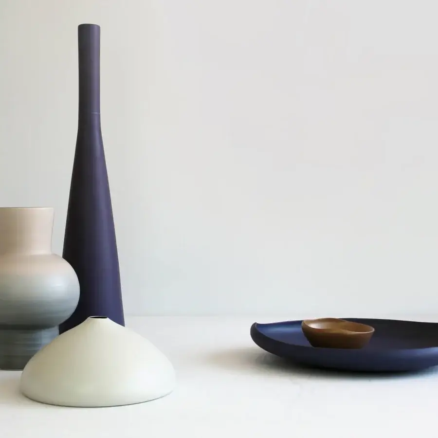 Exclusive Rina Menardi Solo vase crafted in baked clay with a uniformly matte indigo finish