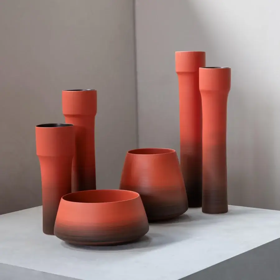 Exceptional Rina Menardi Steli vase crafted from baked clay with a reddish-orange to dark brown gradient and matte finish