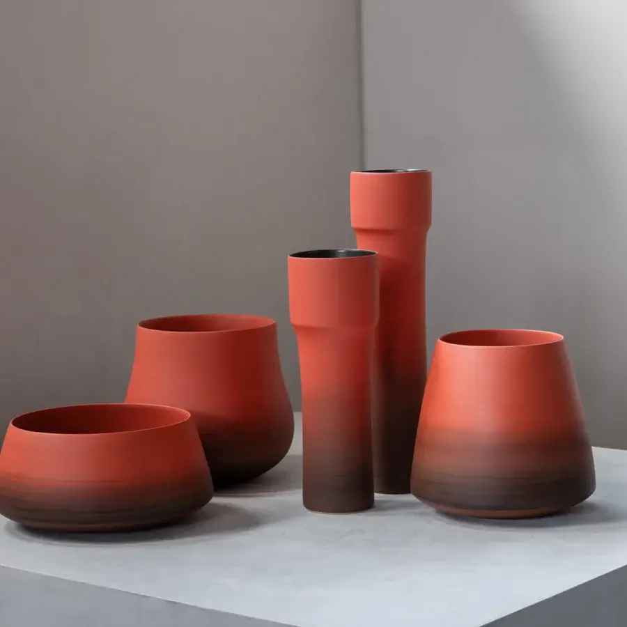 Superior Rina Menardi Steli vase sculpted from baked clay with a warm reddish-brown hue and matte finish
