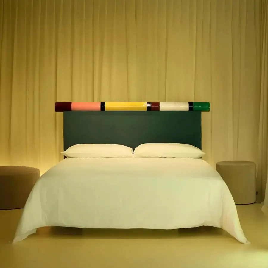 Distinguished Bolzan Letti Rosary headboard crafted in rich teal Pierre Frey velvet with glossy cylindrical ceramics from Nove, Italy