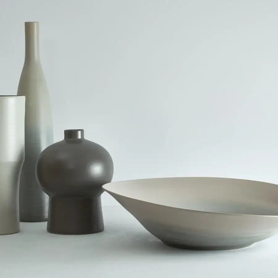 Exceptional Rina Menardi Bottiglie vase crafted from baked clay in muted shades of gray and taupe with a textured matte finish