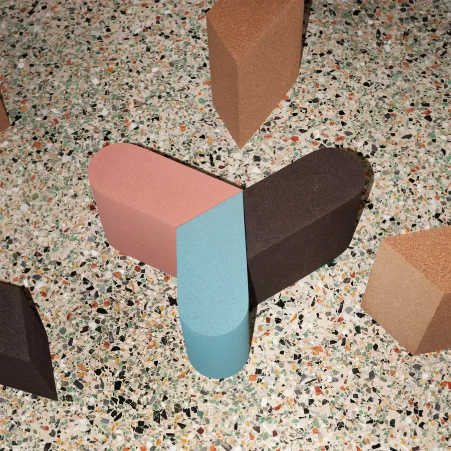 Exceptional Bross Slice Modular Coffee Table, a geometric accent built with cork in rose pink, light blue, and dark brown segments