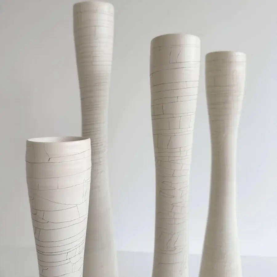 Elegant Rina Menardi Flauti vase, a handcrafted vessel in baked clay with etched lines and matte finish