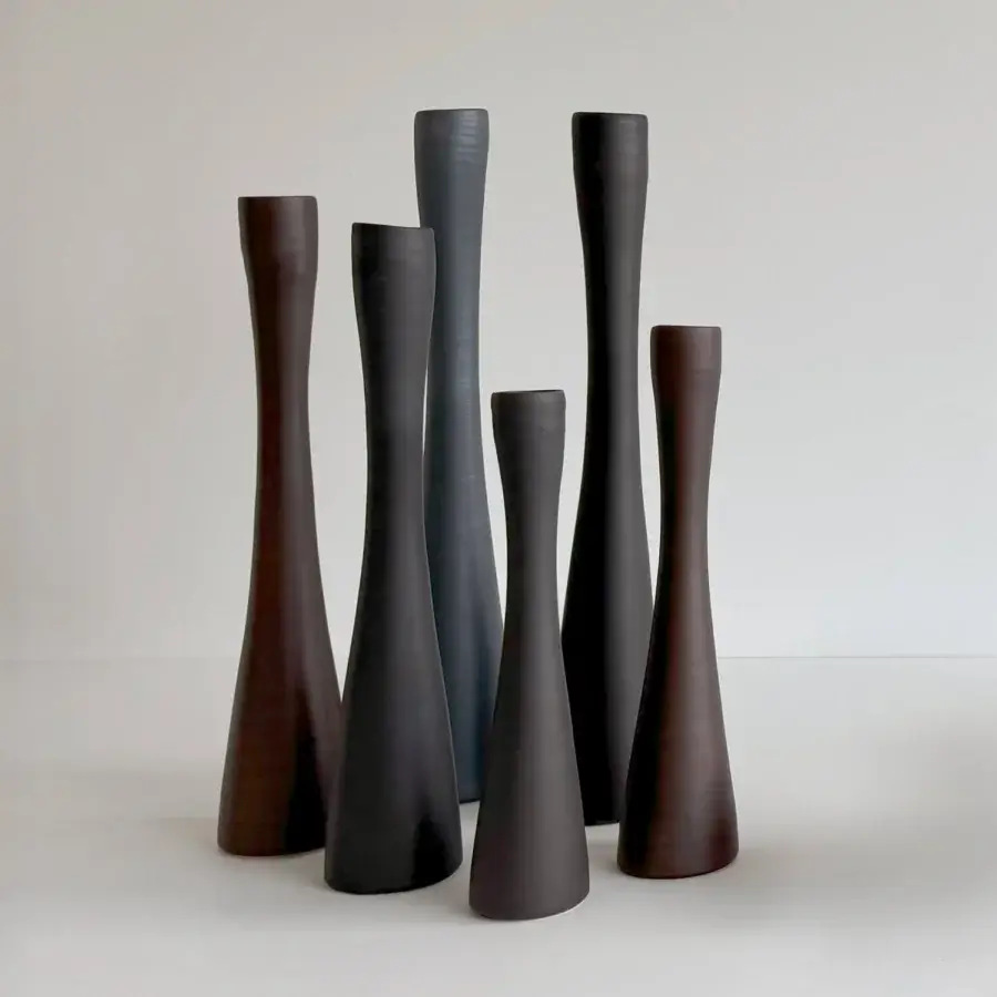 Distinguished Rina Menardi Flauti vase, a sculpted décor piece in blue-gray baked clay with a satin sheen