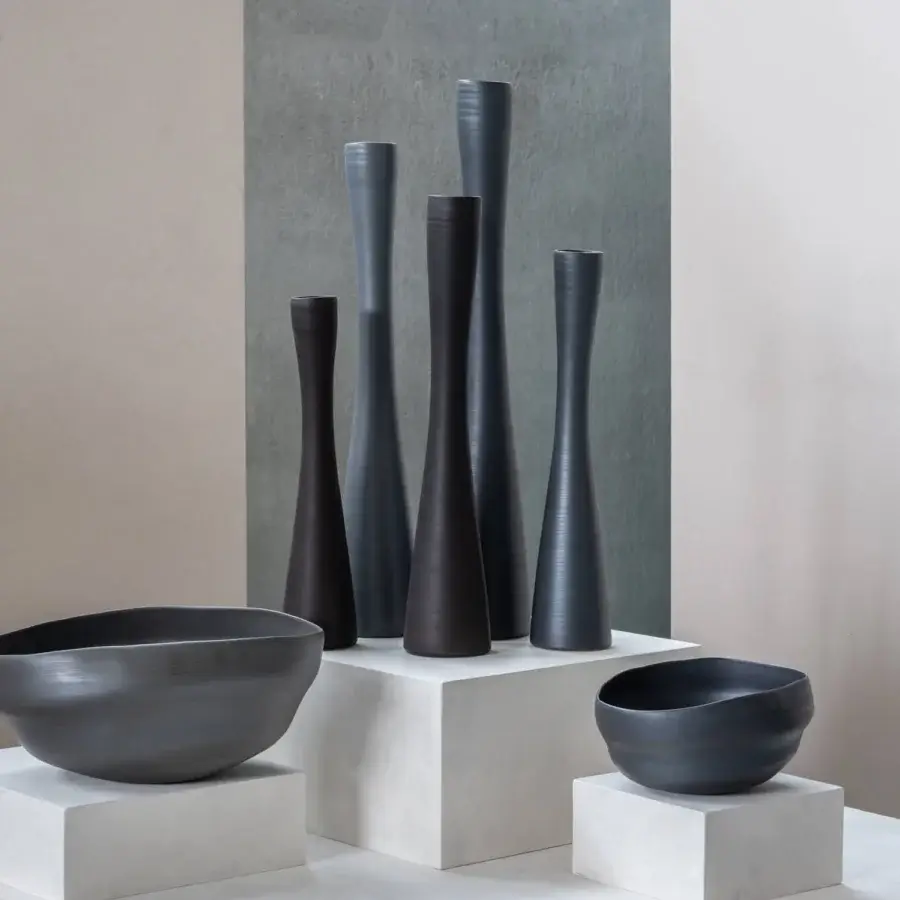 Superior Rina Menardi Flauti vase, a sculpted décor piece crafted in charcoal gray baked clay with a smooth matte finish