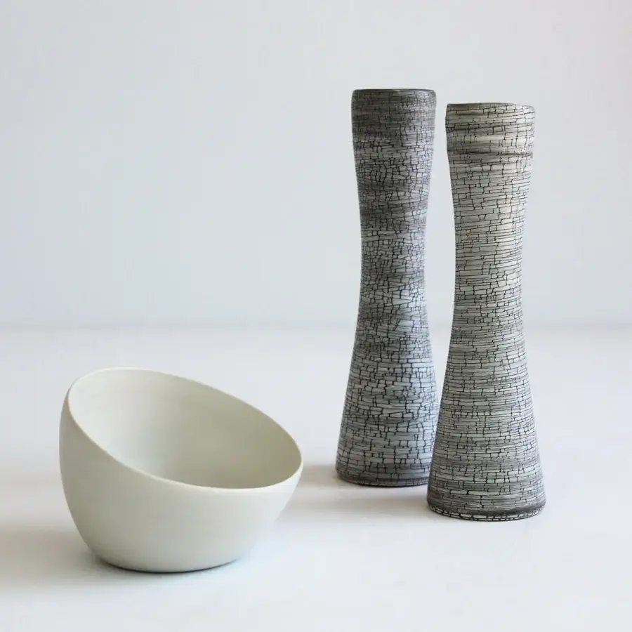 Captivating Rina Menardi Flauti vase, a sculpted décor piece crafted in dark gray and white baked clay with a fractured finish