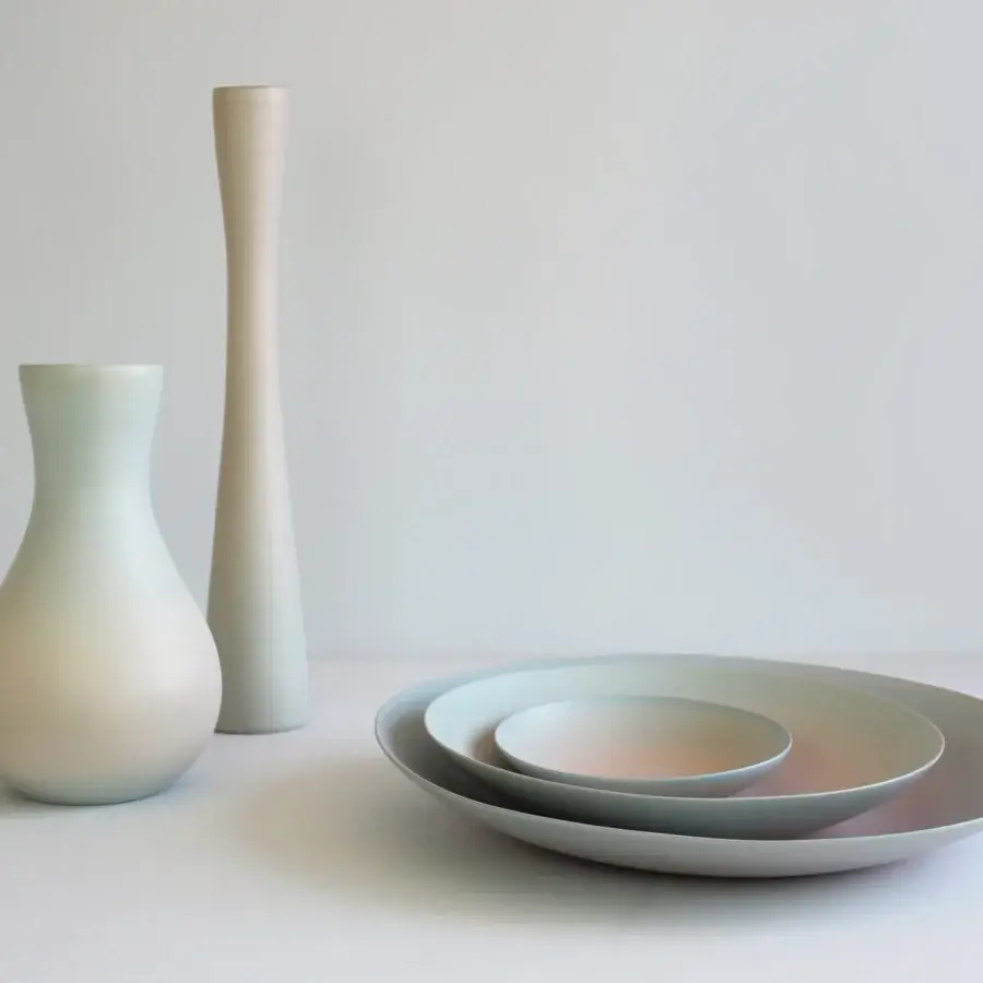 Exclusive Rina Menardi Flauti vase, a cylindrical décor piece handcrafted in Italy from baked clay with a pale grey-green hue
