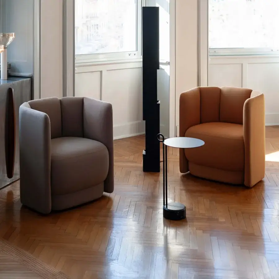Sophisticated Bross Velia lounge chair with warm brown textile upholstery and a subtly scalloped silhouette