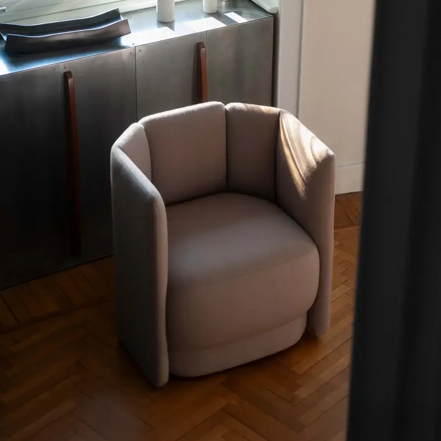 Lavish Bross Velia lounge chair with sculpted form and refined details in textured beige textile upholstery