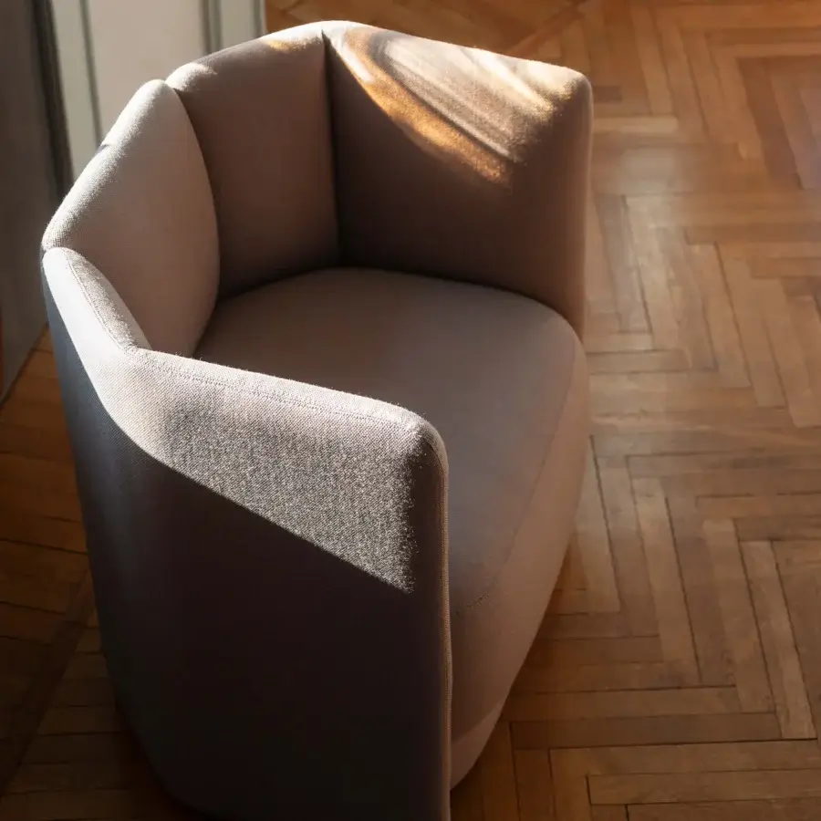 Exceptional Bross Velia lounge chair with comfortably sculpted form and matte textured fabric upholstery