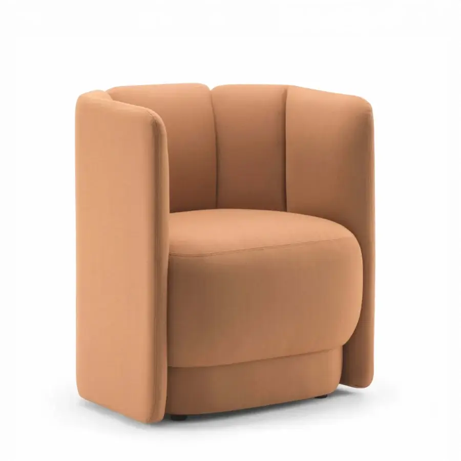 Lavish Bross Velia lounge chair with sculpted form upholstered in terracotta textile featuring vertical channeling and a floating base