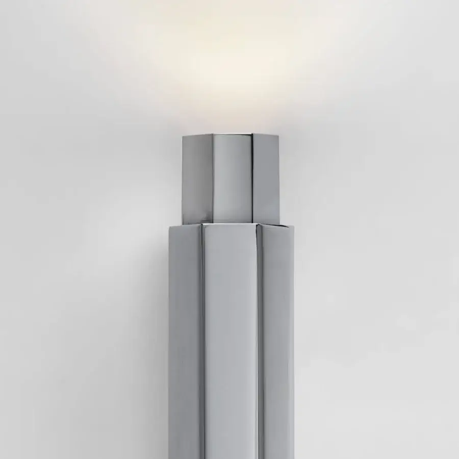 Exceptional Euroluce Castel wall lamp crafted in metal with satin gray finish, exhibiting layered form and subtle gradient illumination