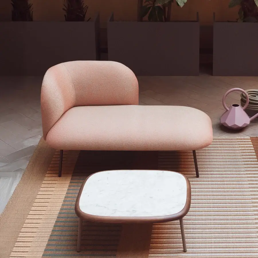 Sophisticated Bross SIT Outdoor chaise lounge in muted coral textured fabric with dark-toned metal frame