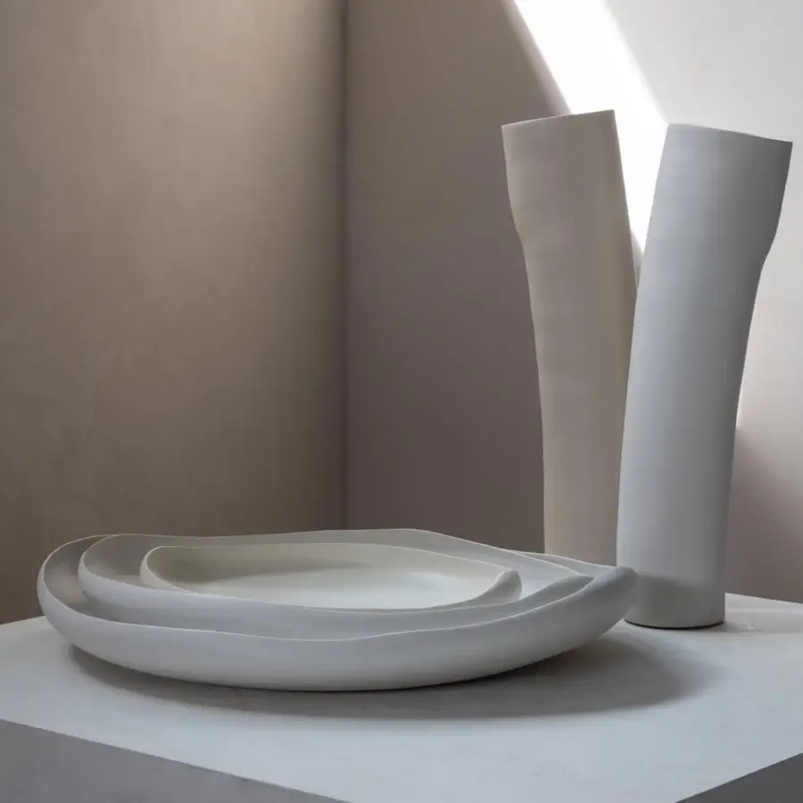 Exclusive Rina Menardi Laguna centerpiece crafted in baked clay with a smooth matte finish and asymmetrical form
