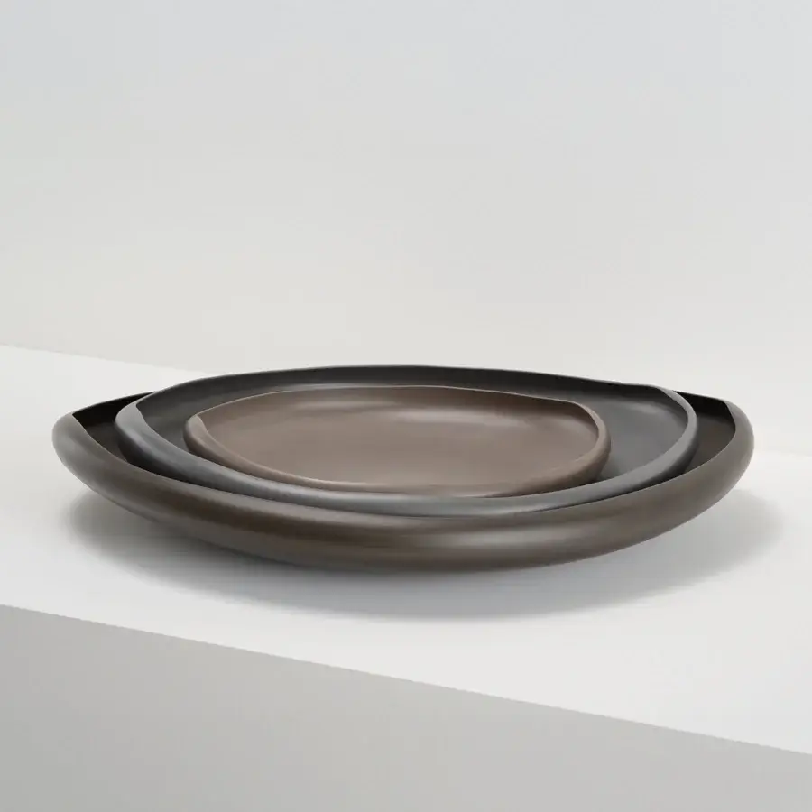 Exceptional Rina Menardi Laguna centerpiece crafted in baked clay with a smooth matte finish in a dark brown hue